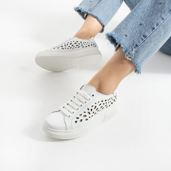 Zapatillas blancas de mujer en piel natural - vista lateral